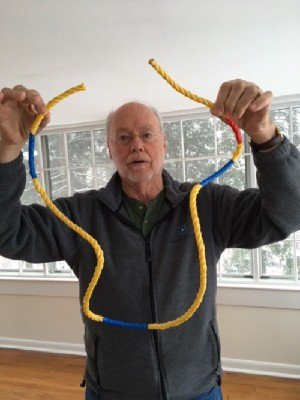 Sharp explains the concept of RNA splicing with rope colored to represent introns and exons.