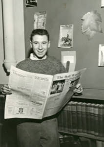 Joe with school newspaper 1958 
